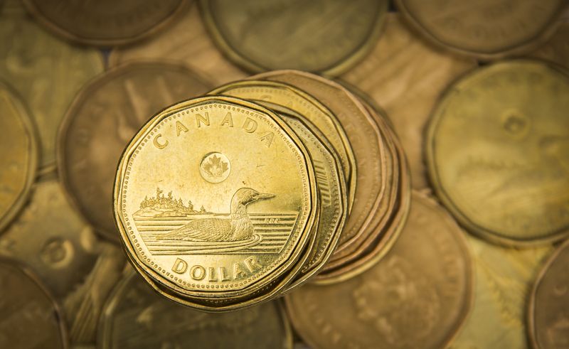 Canadian dollar hits 4-1/2-year low as yield spread weighs