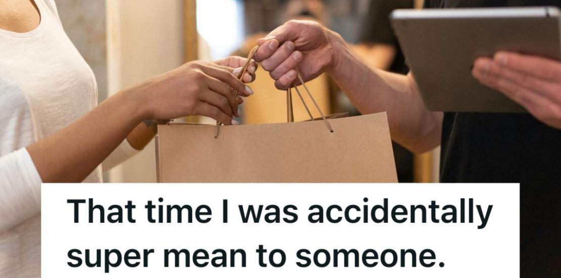 Cashier hands shopper a paper shopping bag