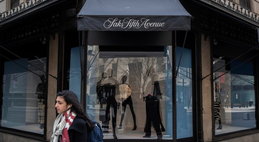 NEW YORK, NY - MARCH 18: Pedestrians pass by Saks Fifth Avenue Department store as it sits closed in the wake of the Coronavirus, COVID19, outbreak on March 18, 2020 in New York City. Businesses continued to close days after bars and restaurants shuttered as authorities in New York weighed a "shelter-in-place" order for the entire city. (Photo by Victor J. Blue/Getty Images)